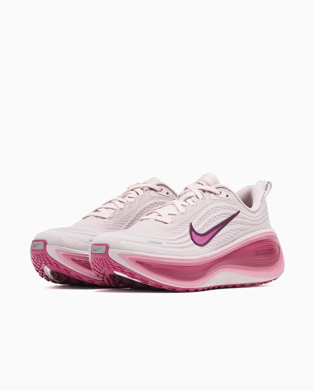 Running Vomero Plus trainers in off white and purple